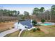 Aerial view of home with a two car garage, screened porch and a large pool at 1158 Wildgame Rd, Summerville, SC 29486