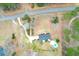 Aerial view of private fenced acreage featuring home and swimming pool with road frontage at 1158 Wildgame Rd, Summerville, SC 29486
