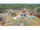 Expansive aerial view of a secluded house, pool, and surrounded by lush greenery at 1158 Wildgame Rd, Summerville, SC 29486