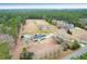 Gorgeous aerial view of a house with swimming pool surrounded by lush green forest at 1158 Wildgame Rd, Summerville, SC 29486