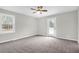 Bedroom with carpet, a ceiling fan, window, and a back door at 1158 Wildgame Rd, Summerville, SC 29486