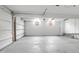 Spacious two-car garage with white walls, concrete flooring, and natural light from two windows at 1158 Wildgame Rd, Summerville, SC 29486