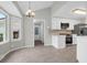 Eat-in kitchen featuring a breakfast nook, stainless steel appliances, and white cabinetry at 1158 Wildgame Rd, Summerville, SC 29486