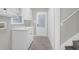 Bright laundry room featuring updated white cabinets and light gray walls at 1158 Wildgame Rd, Summerville, SC 29486