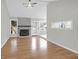 Inviting living room with a brick fireplace, hardwood floors, and a seamless flow to the adjacent spaces at 1158 Wildgame Rd, Summerville, SC 29486