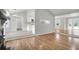 Open layout with hardwood floors connecting the living room to the kitchen at 1158 Wildgame Rd, Summerville, SC 29486