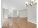 Open-concept living room showcasing spacious layout with hardwood floors and neutral color palette at 1158 Wildgame Rd, Summerville, SC 29486