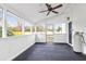 Enclosed back porch with ceiling fan, gas tank, and views of backyard at 1158 Wildgame Rd, Summerville, SC 29486
