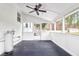 Enclosed back porch with ceiling fan, gas tank, and views of backyard at 1158 Wildgame Rd, Summerville, SC 29486