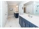 Spacious bathroom with double vanities, quartz countertops, framed mirrors, and modern fixtures at 1166 Elliotts Cut Dr, Charleston, SC 29412