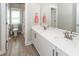 Bathroom with a double sink vanity, tile floors, and a toilet behind a half wall at 1166 Elliotts Cut Dr, Charleston, SC 29412