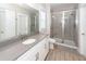 Bathroom features a glass enclosed shower, gray countertops, a toilet, and a white vanity at 1166 Elliotts Cut Dr, Charleston, SC 29412