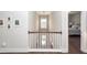 Upper hallway with a view of a living room and bedroom at 1166 Elliotts Cut Dr, Charleston, SC 29412