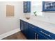 Kitchen featuring custom blue cabinets, granite countertops, and modern fixtures at 1166 Elliotts Cut Dr, Charleston, SC 29412