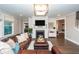 Cozy living room with fireplace and mantle, with hardwood floors and natural light at 1166 Elliotts Cut Dr, Charleston, SC 29412