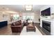Spacious living area with fireplace and elegant decor, with view to dining and kitchen at 1166 Elliotts Cut Dr, Charleston, SC 29412