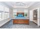 Comfortable main bedroom with tray ceiling, featuring a wooden bed frame and an ensuite bathroom at 1166 Elliotts Cut Dr, Charleston, SC 29412