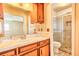 Bathroom featuring a vanity with generous storage and a step-in shower with sliding glass doors at 1198 Oakcrest Dr, Charleston, SC 29412