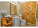 Unique bathroom showcasing a modern vanity, decorative mirror, and textured wall paneling at 120 Luden Dr # C, Summerville, SC 29483