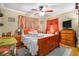Comfortable bedroom with a queen bed, ceiling fan, and warm, inviting decor at 120 Luden Dr # C, Summerville, SC 29483