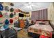 Eclectic bedroom showcases a ceiling fan, work area, and unique decor accents at 120 Luden Dr # C, Summerville, SC 29483