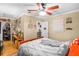 Inviting bedroom with ceiling fan, workspace, shelving, and ample natural light at 120 Luden Dr # C, Summerville, SC 29483