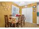 Cozy dining area featuring a wooden table, chairs, shuttered windows, and white closet doors at 120 Luden Dr # C, Summerville, SC 29483