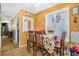 Bright dining room with wooden table, chairs, shutters, and 'Gather' decor on the wall at 120 Luden Dr # C, Summerville, SC 29483