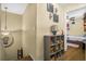 Hallway with decor, storage shelves and view into an adjacent room with a bed at 120 Luden Dr # C, Summerville, SC 29483