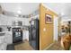 Well-equipped kitchen with black appliances and white cabinets offers a functional cooking space at 120 Luden Dr # C, Summerville, SC 29483
