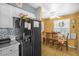 Bright kitchen featuring stainless steel appliances, countertops, and a dining area with seating at 120 Luden Dr # C, Summerville, SC 29483