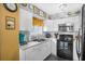 Charming kitchen features white cabinets, modern appliances, and a decorative backsplash at 120 Luden Dr # C, Summerville, SC 29483