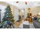 Cozy living room featuring a Christmas tree, area rug, sofa, and a doorway leading to other rooms at 120 Luden Dr # C, Summerville, SC 29483