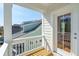 Balcony view with white railing overlooks a house with blue siding at 125 Cantona Dr, Summerville, SC 29483
