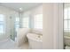 Bright bathroom featuring a glass enclosed shower and free standing tub at 125 Cantona Dr, Summerville, SC 29483