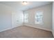 A light-filled bedroom with windows and a closet at 125 Cantona Dr, Summerville, SC 29483