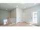 Bright hallway at the top of the stairs with a pair of doors and wood floors at 125 Cantona Dr, Summerville, SC 29483