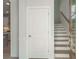 Hallway view showcasing staircase with natural lighting and showcasing entry to kitchen at 125 Cantona Dr, Summerville, SC 29483