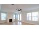 Spacious living room boasts a cozy fireplace, abundant natural light, and elegant ceiling fan at 125 Cantona Dr, Summerville, SC 29483