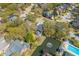 Beautiful aerial view of the community, highlighting lush landscaping, private pool, and serene pond with fountain at 1324 Southlake Dr, Mount Pleasant, SC 29464