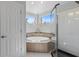 This bright bathroom features a glass enclosed shower and large soaking tub at 1324 Southlake Dr, Mount Pleasant, SC 29464