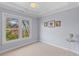 Light-filled bedroom with neutral walls, large window, and crown molding at 1324 Southlake Dr, Mount Pleasant, SC 29464