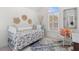 Bedroom with a cozy daybed, window, and vintage decor at 1324 Southlake Dr, Mount Pleasant, SC 29464