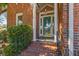 Welcoming front entrance featuring a green door, brick steps, and a decorative sidelight window at 1324 Southlake Dr, Mount Pleasant, SC 29464