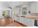 Spacious kitchen featuring white cabinets, granite countertops, stainless steel appliances, and hardwood floors at 1324 Southlake Dr, Mount Pleasant, SC 29464