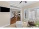 Bright sunroom leading to a living room with a fireplace, hardwood floors, and lots of natural light at 1324 Southlake Dr, Mount Pleasant, SC 29464