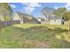 Large fenced backyard showcasing a shed and covered patio, ideal for relaxation and entertaining guests at 136 Rosario Dr, Summerville, SC 29483
