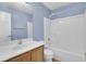 Bathroom featuring a shower-tub combo with a toilet and wood cabinet sink offering practical and stylish functionality at 136 Rosario Dr, Summerville, SC 29483
