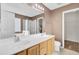 Bathroom featuring a double sink vanity, large mirror, shower, and great lighting, perfect for morning routines at 136 Rosario Dr, Summerville, SC 29483