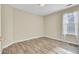 Bedroom with wood-look flooring and natural light from a window with window treatment at 136 Rosario Dr, Summerville, SC 29483